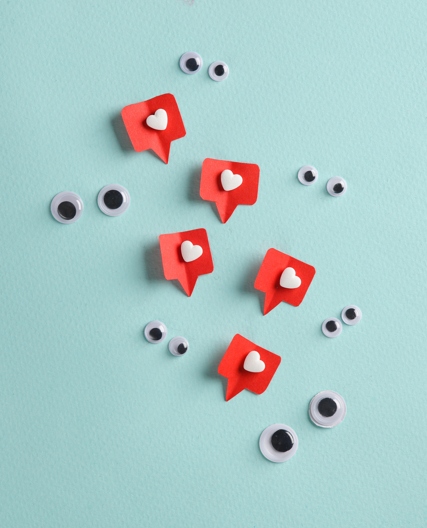 Goggle eyes with social media likes on blue background. Creative minimal layout
